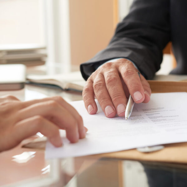 Business people signing a contract